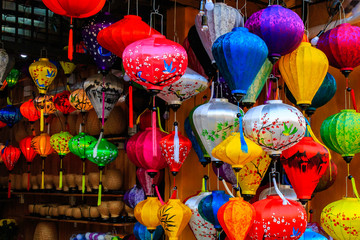 Traditional Vietnamese lamps are popular souvenir in Hoi An. Lanterns at street market in mid-autumn festival, many lanterns hanging on street.