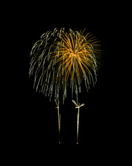 Golden exploded fireworks isolated on black background