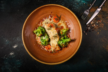 fish with broccoli (delicious fish dish, baked main course) menu concept. food background. copy space. Top view