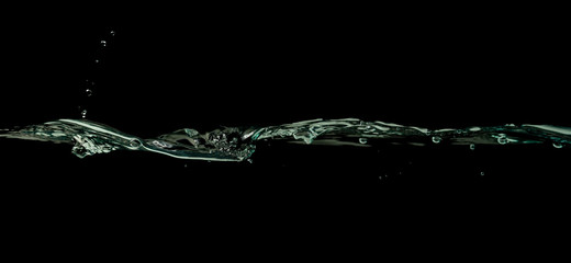 Water wave splash isolated black background.