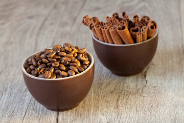 Two Cups With Cinnamon Sticks And Coffee Beans