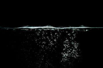 water splash isolated on dark black background