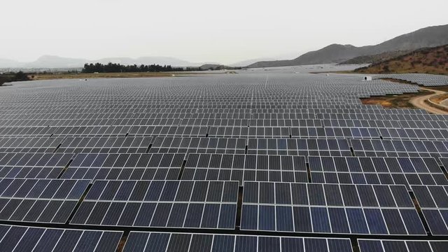 Aerial Drone Shot of Photovoltaic plant on a clody day, Chile-4K