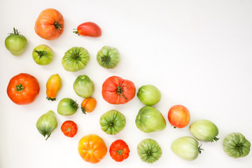 Summer harvest of vegetables concept. Set of green and red tomatoes.