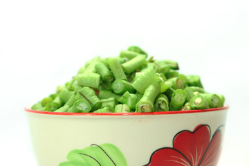  Long beans hatched into plates, placed on a plate on a white background
