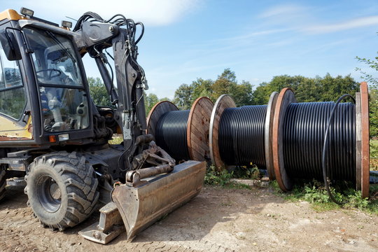 Cable reel and a excavator outdoors