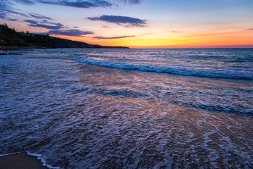 Amazing flow sea wave, wide-angle view, a beautiful view with first rays over the sea.
