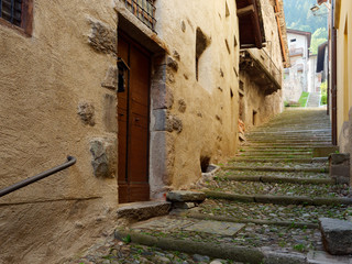 old wooden door on the wall of an italian house