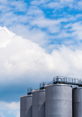 steel tanks on sky background