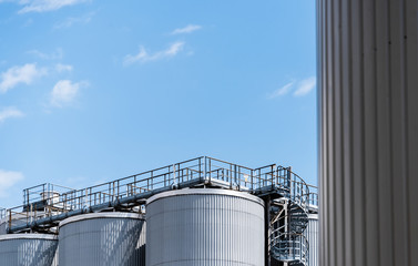 steel tanks on sky background