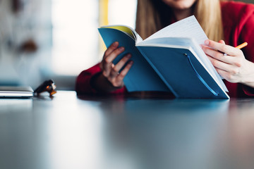 Woman working with notepad, close-up