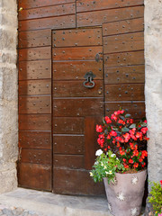 old wooden door on the wall of an italian house