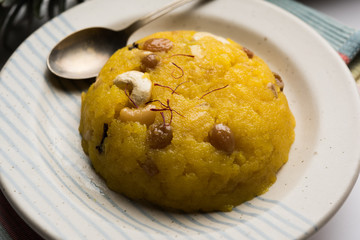 Pineapple sheera or Halwa also known as Ananas keshri shira. Popular South Indian Dessert recipe. selective focus