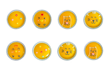 Top view minimal orange cake with butter cream in foil cup isolated on white background.