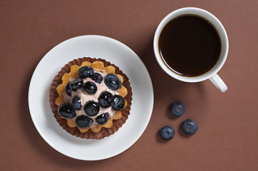 Cheesecake with blueberries and coffee