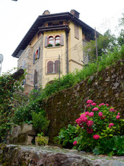 old wooden door on the wall of an italian house
