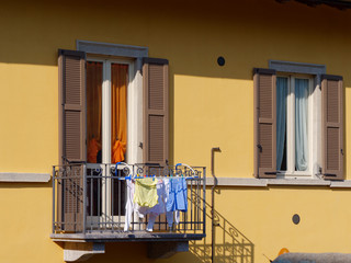 old wooden door on the wall of an italian house