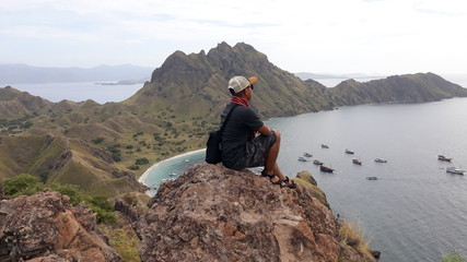 man on top of mountain