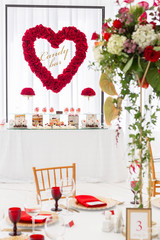 Candy bar with a lot of desserts, meringue, cupcake, fruit and sweet cakes. Sweet table for birthday or wedding.
