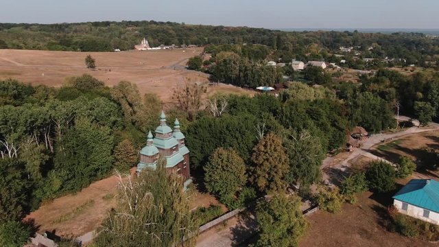 aerial view old wooden church  in traditional village  open air museum of flork architecture  pirogovo v Ukraine Kiev HD video