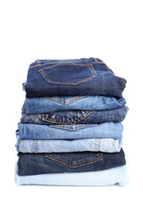 Stack of jeans pants on white background - Image