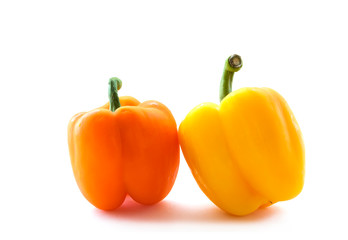 Fresh orange and yellow bell pepper isolated on white background