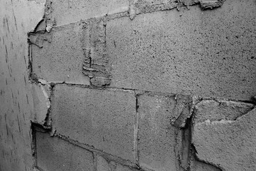 Side view of cement cracked wall show brick texture