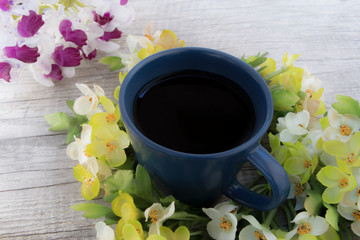 Blue coffee cup with Small flower and orchid. Concept relaxation in free time with nice drink and refreshing with flower