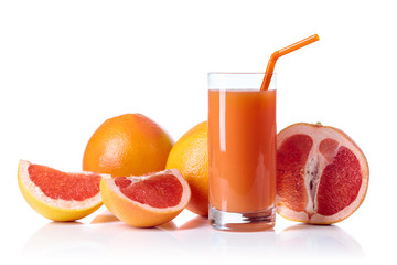 Glass of fresh grapefruit juice and cut fruits white background.