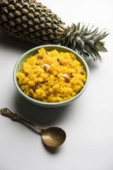 Pineapple sheera or Halwa also known as Ananas keshri shira. Popular South Indian Dessert recipe. selective focus