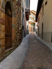 old wooden door on the wall of an italian house