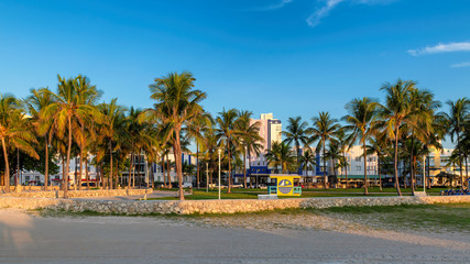 Fototapeta na wymiar Miami Beach at sunrise - hotels and restaurants at morning in Ocean Drive, South Beach, Miami, Florida, USA.