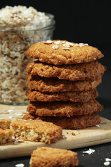 Homemade oatmeal cookie at dark background	