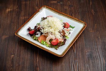 Salad with lettuce and prawns. Restaurant menu