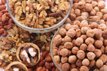 Different nuts in glass cups