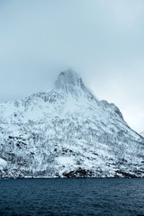 Dramatic winter sea and epic snowy mountains, Lofoten islands in Norway