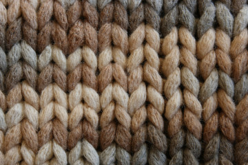 Knitted fabric from a large woolen thread in multicolor color