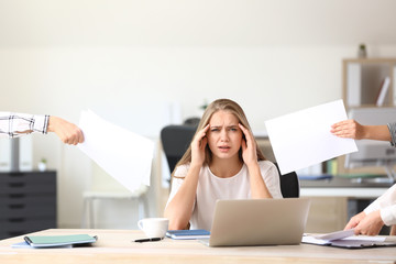 Woman having panic attack at workplace