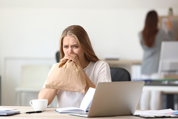 Woman having panic attack at workplace