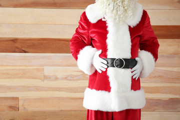 Santa Claus on wooden background