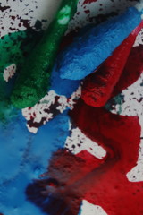Cotton buds dipped in poster color. The background is full of red, green and bule colors.