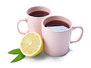 Obraz na płótnie Canvas Cups of hot tea with lemon on white background