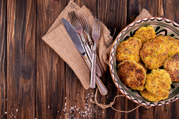 Juicy homemade fried meat and vegetable cutlets with herbs. Turkey, chicken, carrot,  onion, garlic, cubbage, eryngii mushroom, arugula, spinach. Top view