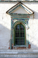 Fototapeta na wymiar Photo of a window on an old white stone house