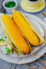 Traditional summer food. Baked corn cobs with spices.