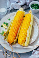 Traditional summer food. Baked corn cobs with spices.