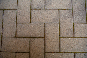 Old red brick wall. Old concrete wall. The facade of the house built of solid stone cement