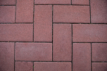 Old red brick wall. Old concrete wall. The facade of the house built of solid stone cement