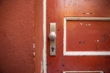 Old red brick wall. Old concrete wall. The facade of the house built of solid stone cement