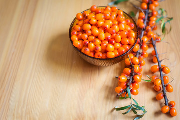 berries in a bowl on wooden table